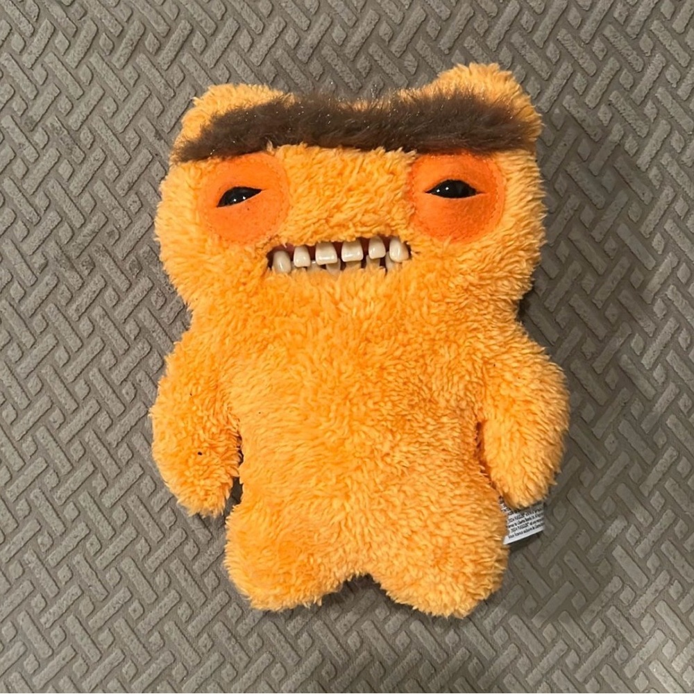 Orange Stuffed Monster Toy